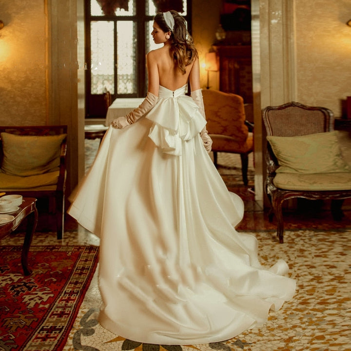 AMARA<br>Satin Vintage Inspired Strapless Backless Midi Bridal Gown With Big Back Bow