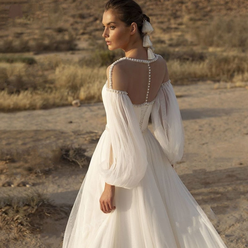 IZOLTE<br>Beaded Illusion Long Sleeve A-Line Boho Style Crystal Belt Court Train Wedding Dress