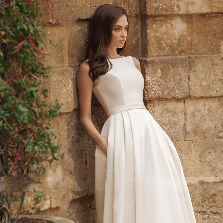 ROWENA<br>Elegant Scoop Neck Beaded Appliqué Button-up Satin Bridal Gown