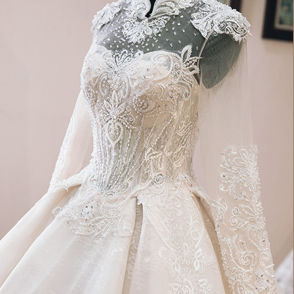 NURA<br>Oriental Luxury Beaded Appliqué Long Sleeve High Neck Ball Gown Wedding Dress