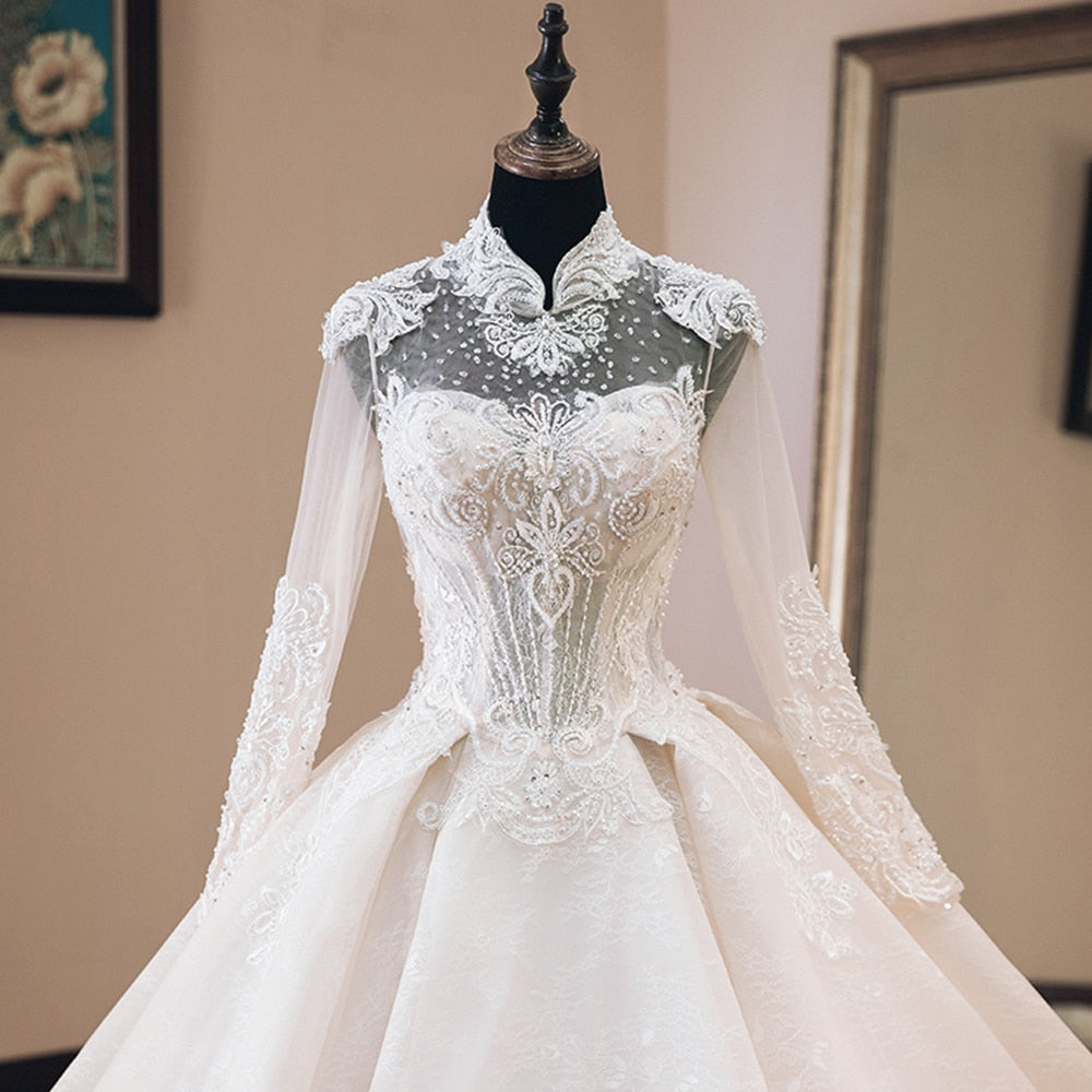 NURA<br>Oriental Luxury Beaded Appliqué Long Sleeve High Neck Ball Gown Wedding Dress
