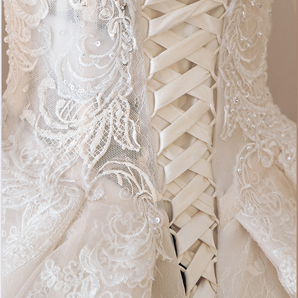 NURA<br>Oriental Luxury Beaded Appliqué Long Sleeve High Neck Ball Gown Wedding Dress